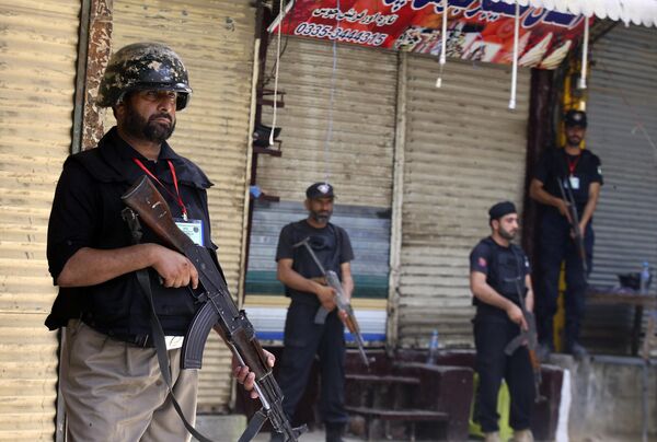 Police stand guard during the Ashoura procession in Peshawar, Pakistan, Friday, July 21, 2023. Police stand guard during the Ashoura procession in Peshawar, Pakistan, Friday, July 21, 2023. - Sputnik India