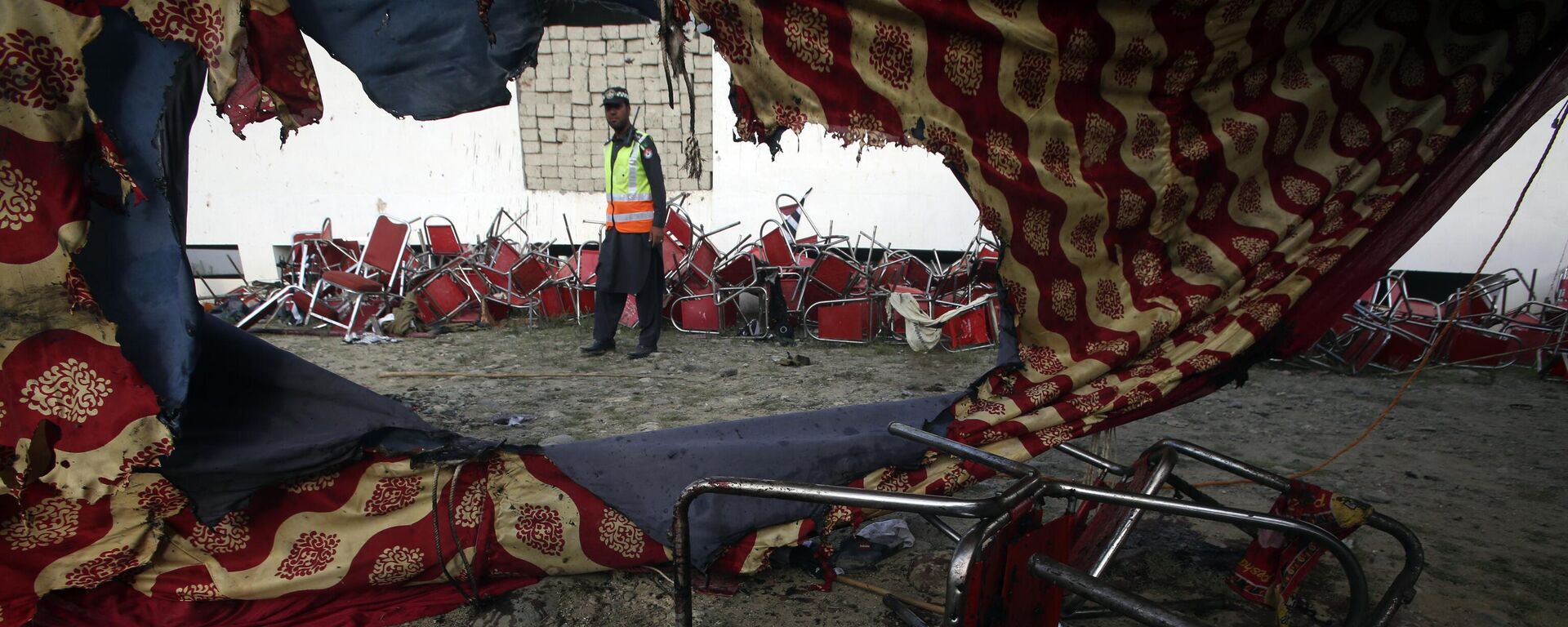 Chairs with blood stain are seen on the ground after Sunday's suicide bomber attack in the Bajur district of Khyber Pakhtunkhwa, Pakistan, Monday, July 31, 2023. - Sputnik India, 1920, 08.02.2024