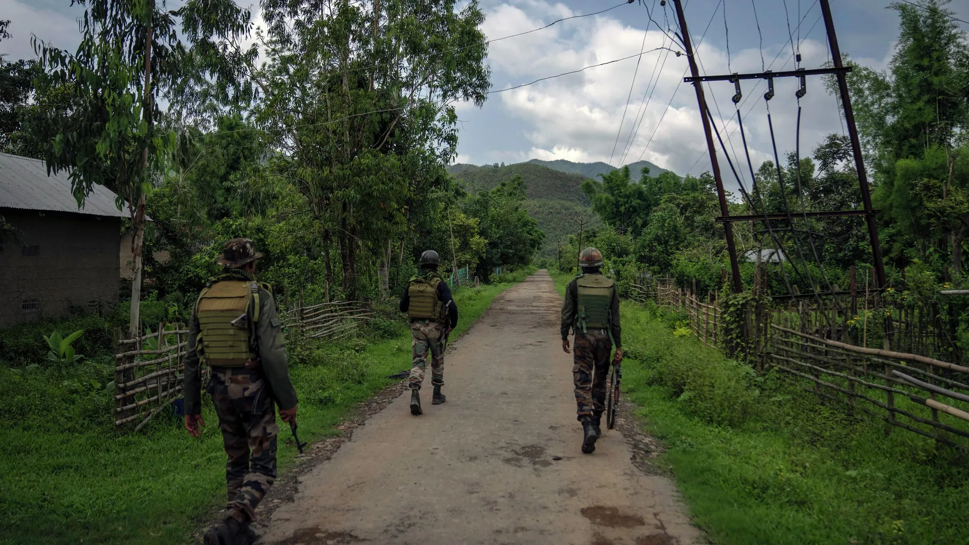 Indian army soldiers patrol a deserted village in Churachandpur, in the northeastern Indian state of Manipur, Tuesday, June 20, 2023.