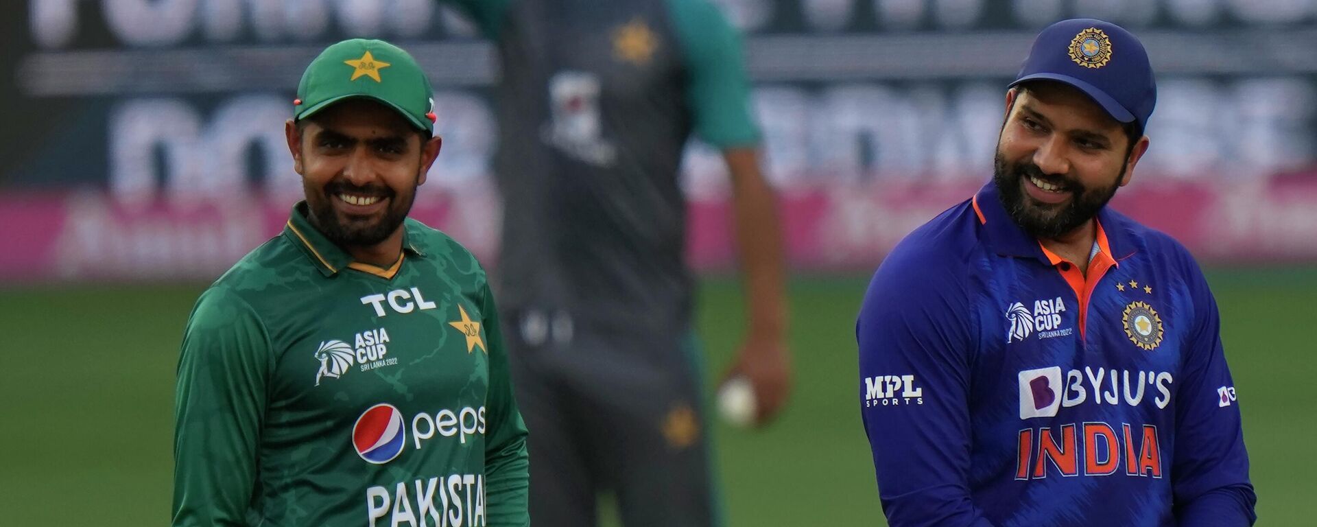 Pakistan's captain Babar Azam, left, and India's captain Rohit Sharma smile as they wait for the toss ahead of the T20 cricket match of Asia Cup between India and Pakistan, in Dubai, United Arab Emirates, Sunday, Sept. 4, 2022. - Sputnik India, 1920, 11.08.2023