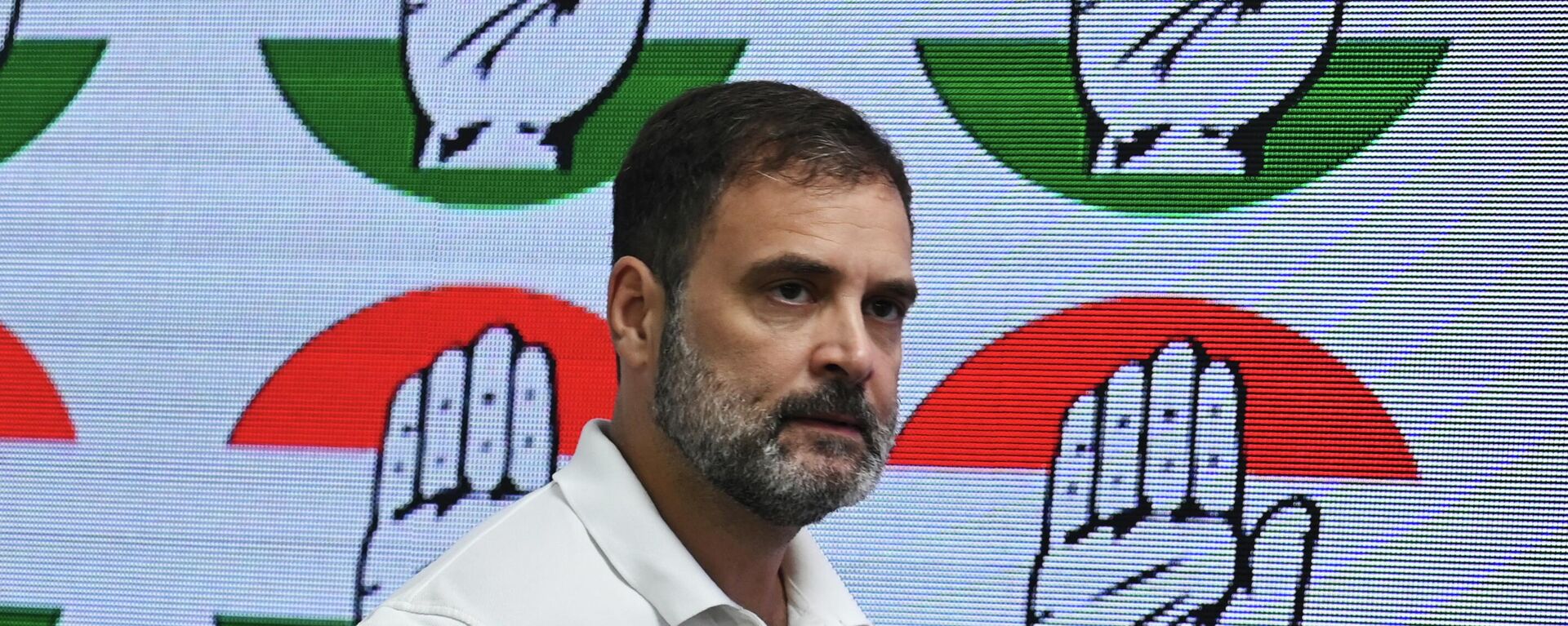 In this file photo taken on August 4, 2023, India's Congress party leader Rahul Gandhi arrives for a media briefing at the party headquarters in New Delhi, after the Supreme Court suspended his defamation conviction. India's main opposition leader Rahul Gandhi was restored to parliament on August 7 after the country's Supreme Court last week suspended his defamation conviction over his political comments on Prime Minister Narendra Modi. The 53-year-old Congress party leader was sentenced to two years' imprisonment in March in a case that critics flagged as an effort to stifle political opposition in the world's largest democracy. - Sputnik भारत, 1920, 07.08.2023