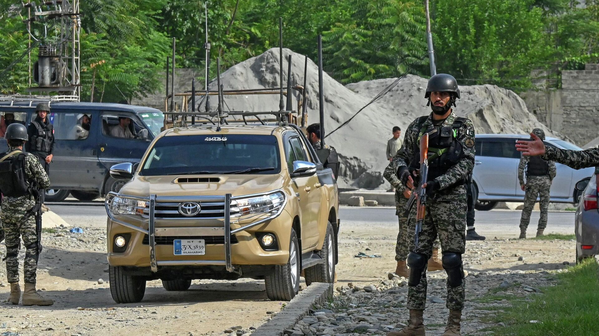 Security personnel stand guard at the site of a bomb blast in Bajaur district of Khyber-Pakhtunkhwa province on July 31, 2023. At least 44 people were killed and more than 100 others wounded on July 30 by a suicide bombing at a political gathering of a leading Islamic party in northwest Pakistan, officials said. - Sputnik India, 1920, 04.09.2023