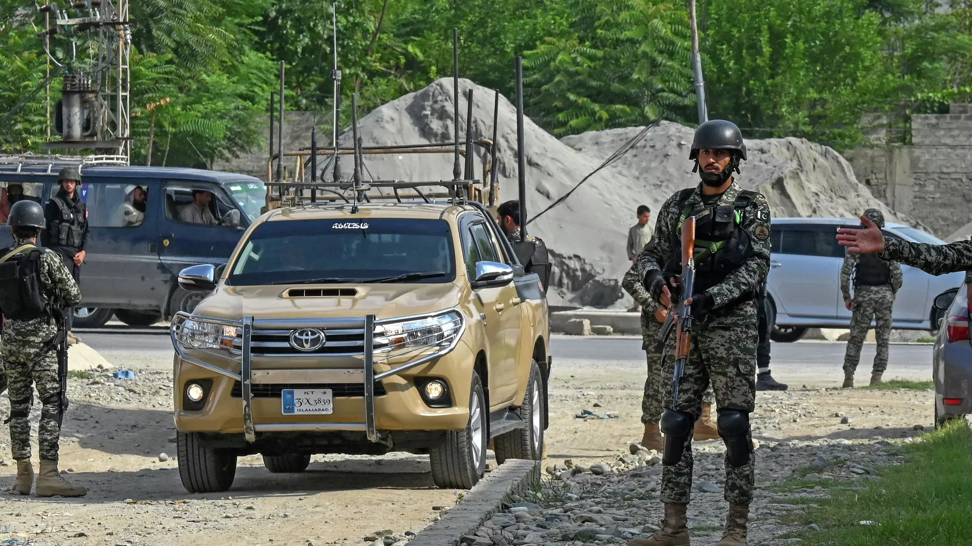 Security personnel stand guard at the site of a bomb blast in Bajaur district of Khyber-Pakhtunkhwa province on July 31, 2023. At least 44 people were killed and more than 100 others wounded on July 30 by a suicide bombing at a political gathering of a leading Islamic party in northwest Pakistan, officials said. - Sputnik India, 1920, 04.09.2023