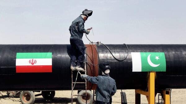 FILE - In this March 11, 2013 file photo, Iranian workers weld two gas pipes together at the start of construction on a pipeline to transfer natural gas from Iran to Pakistan, in Chabahar, southeastern Iran, near the Pakistani border - Sputnik India