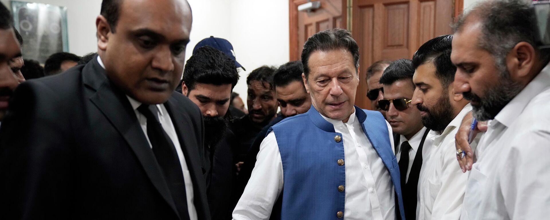 Pakistan's former Prime Minister Imran Khan arrives to sign documents as he submits surety bond over his bails in different cases at an office of Lahore High Court in Lahore, Pakistan - Sputnik भारत, 1920, 29.08.2023