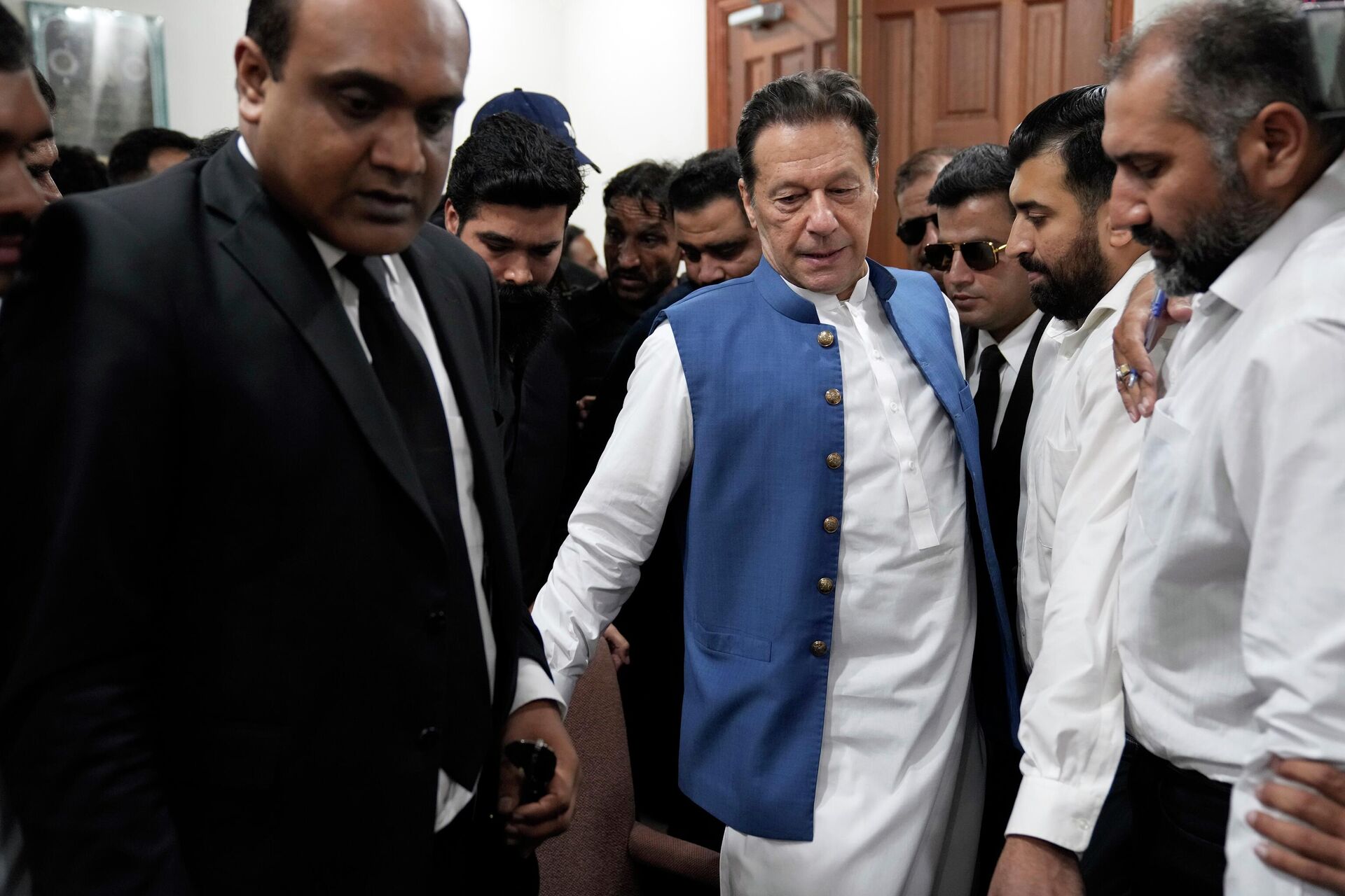 Pakistan's former Prime Minister Imran Khan arrives to sign documents as he submits surety bond over his bails in different cases at an office of Lahore High Court in Lahore, Pakistan - Sputnik India, 1920, 29.08.2023