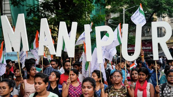 Members of the student wing of the All India Trinamool Congress party stand in solidarity with the people of Manipur during a protest - Sputnik India