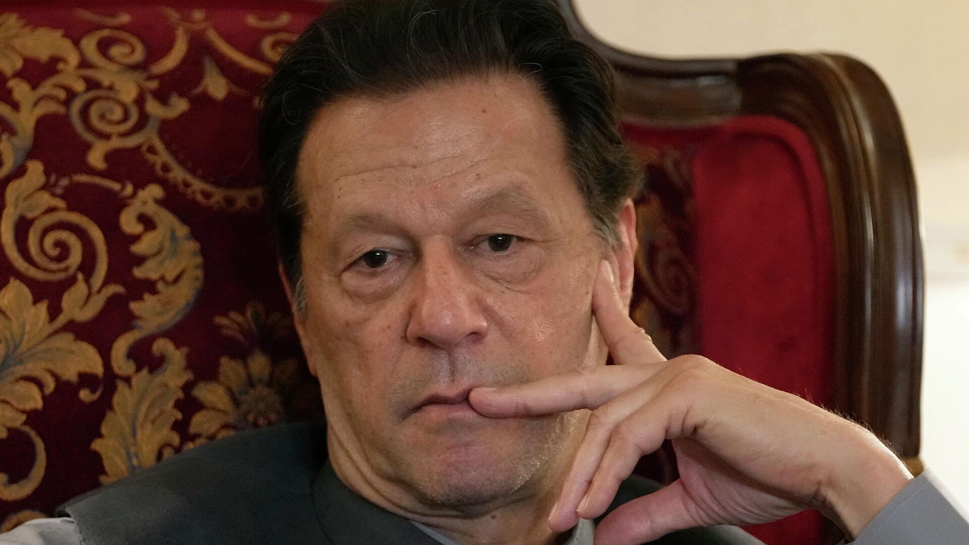 Pakistan's former prime minister Imran Khan listens to a member of media during talk with reporters regarding the current political situation and the ongoing cases against him at his residence, in Lahore, Pakistan, Thursday, Aug. 3, 2023. - Sputnik भारत, 1920, 24.12.2023