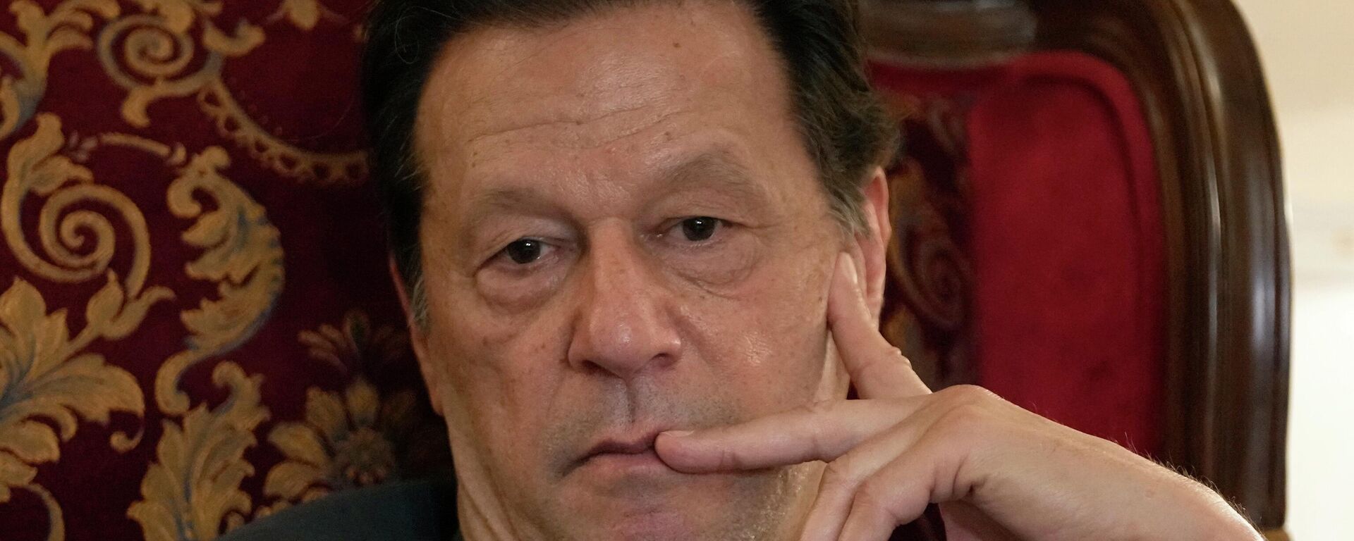 Pakistan's former prime minister Imran Khan listens to a member of media during talk with reporters regarding the current political situation and the ongoing cases against him at his residence, in Lahore, Pakistan, Thursday, Aug. 3, 2023. - Sputnik India, 1920, 15.01.2024