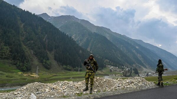 Paramilitary soldiers stand guard near the under-construction Zojila tunnel, which will connect Srinagar to the union territory of Ladakh, in Baltal on September 28, 2021.  - Sputnik India