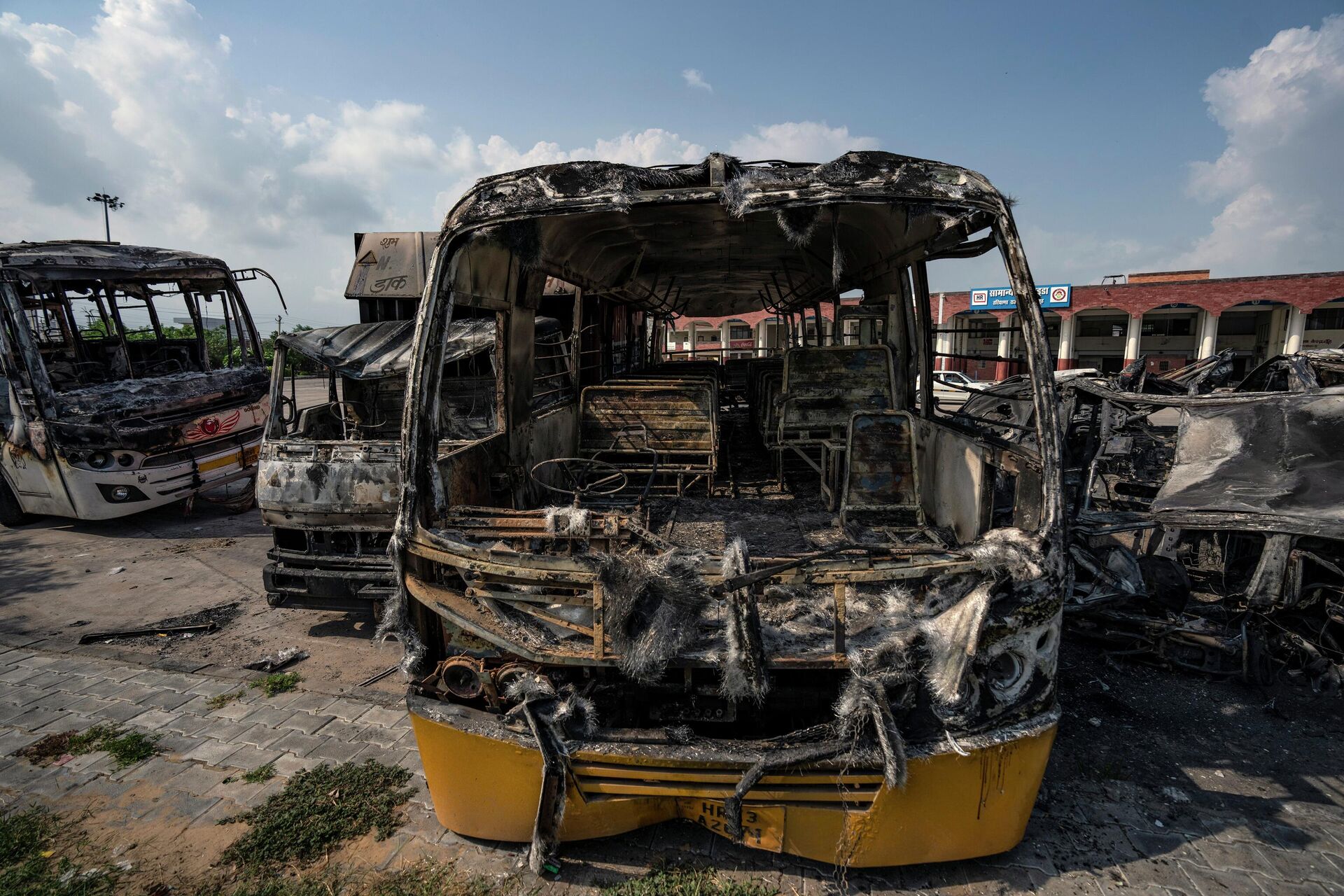 Burnt vehicles stand in a transport yard in Nuh in Haryana state, India, Tuesday, Aug., 1, 2023. - Sputnik India, 1920, 15.08.2023