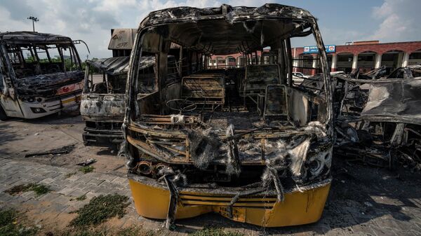 Burnt vehicles stand in a transport yard in Nuh in Haryana state, India, Tuesday, Aug., 1, 2023. - Sputnik India