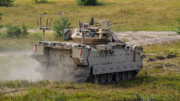 Modified Bradley Fighting Vehicles known as Mission Enabling Technologies Demonstrators (MET-D) and modified M113 tracked armored personnel carriers, known as Robotic Combat Vehicles (RCVs) are being utilized in a soldier operation experimentation at Ft. Carson, Col., from June 15 – Aug. 14, 2020. - Sputnik भारत