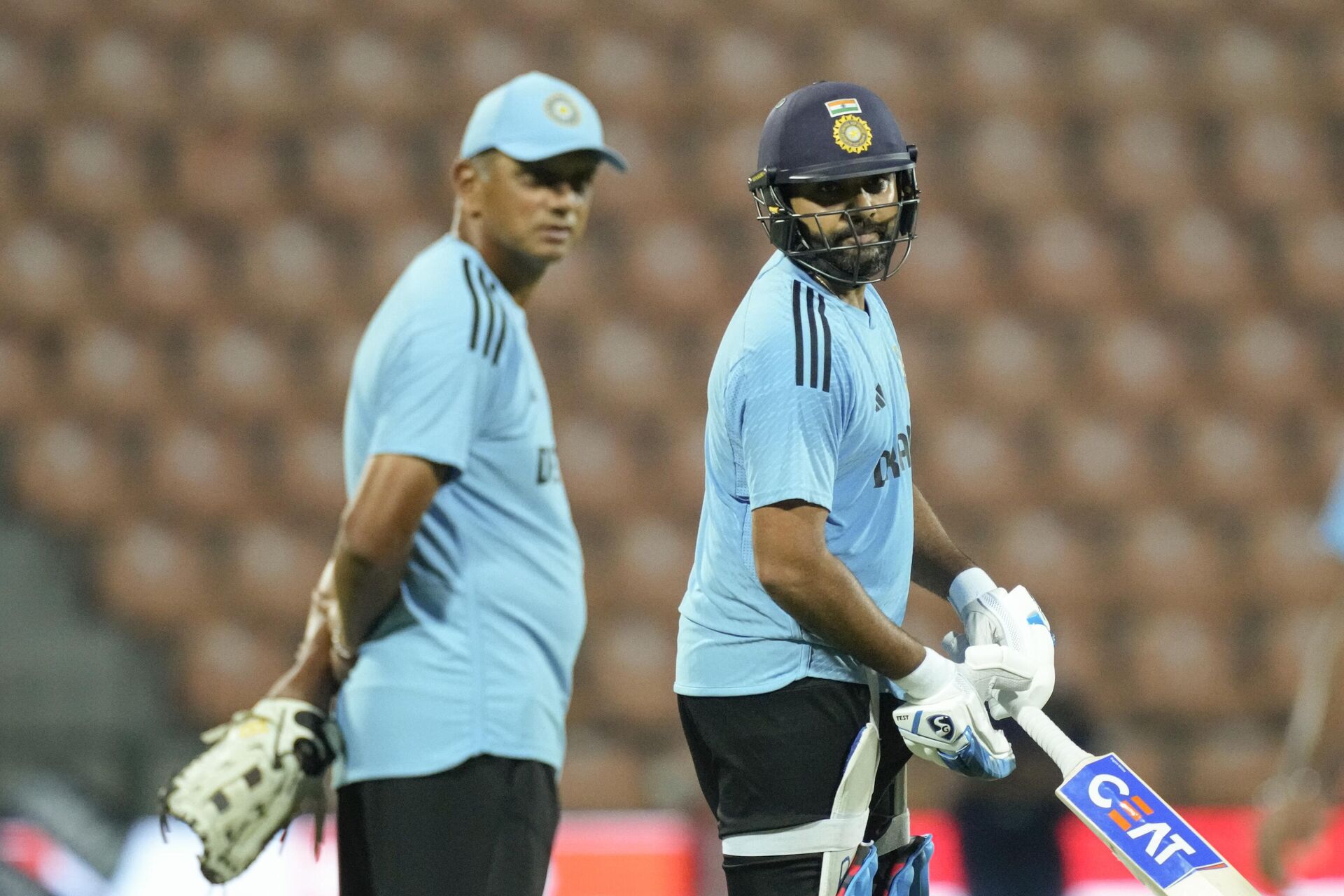 India's captain Rohit Sharma, right, and coach Rahul Dravid attend a practice session ahead of their one day international cricket match of Asia Cup with Pakistan in Pallekele, Sri Lanka on Friday, Sep. 1, 2023.  - Sputnik India, 1920, 20.09.2023