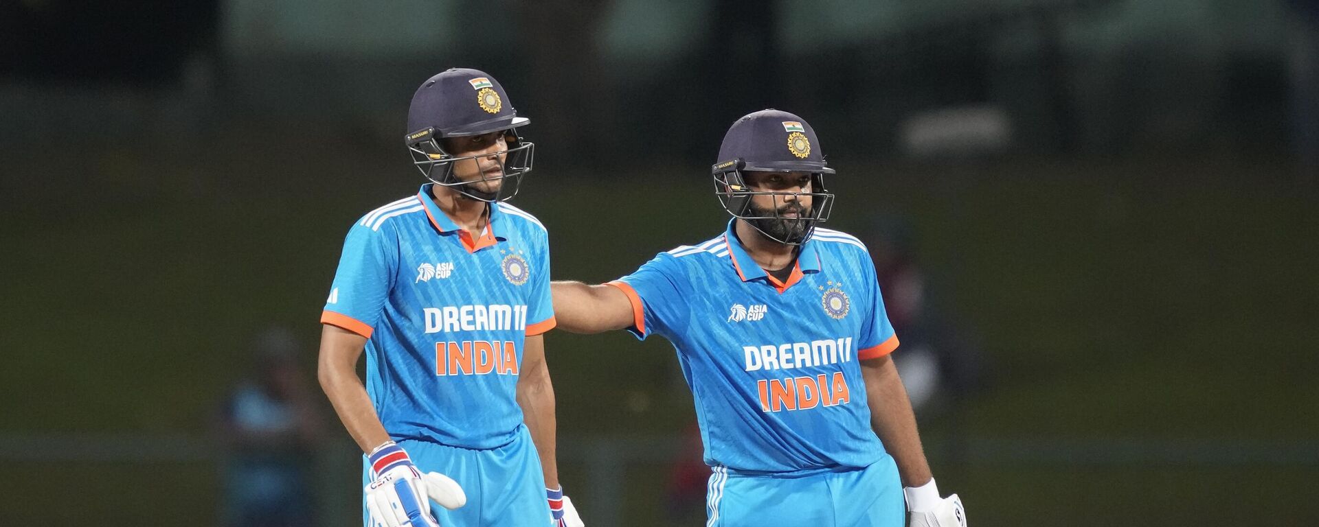 India's Rohit Sharma, right, congratulates Shubman Gill for scoring a half century during the Asia Cup cricket match between India and Nepal in Pallekele, Sri Lanka on Monday, Sep. 4. - Sputnik भारत, 1920, 31.10.2023