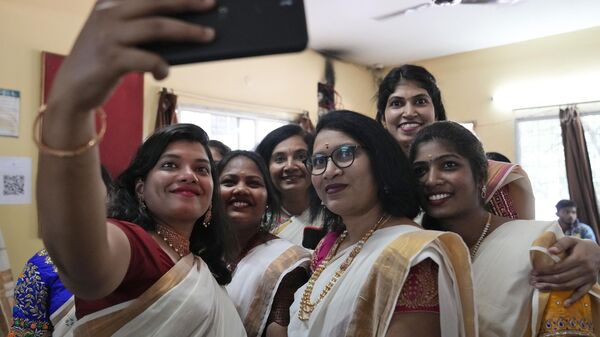 Women dressed in traditional saris take a selfie during festivities marking Onam in Hyderabad, India, Tuesday, Aug. 29, 2023. Onam is an annual harvest festival celebrated mainly in the southern Indian state of Kerala.  - Sputnik India