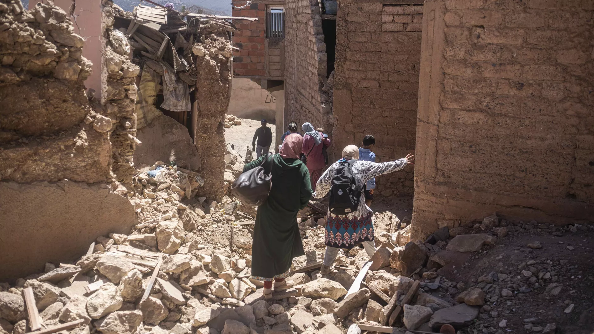 Residents flee their homes after an earthquake in Moulay Brahim village, near the epi centre of the earthquake, outside Marrakech, Morocco