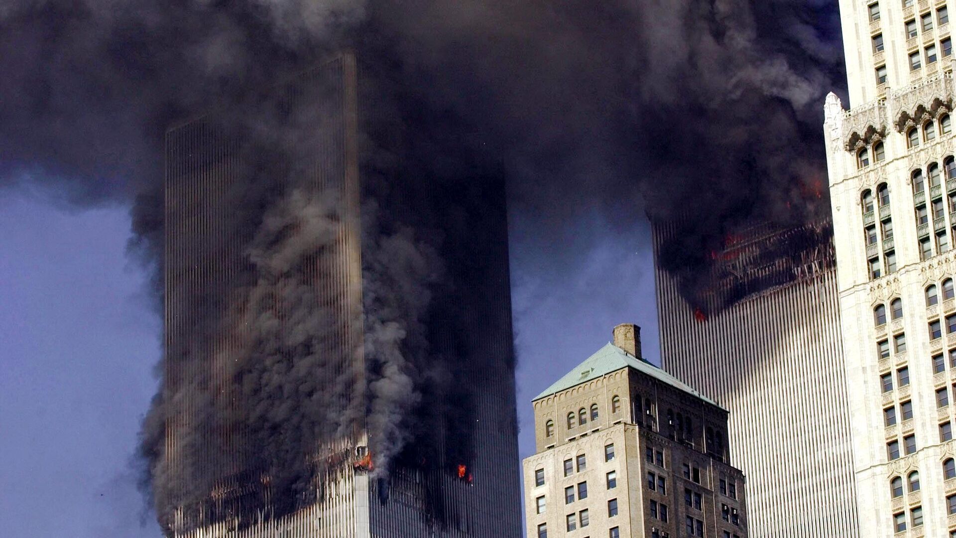  In this file photo smoke billows from the twin towers of the World Trade Center in lower Manhattan, New York on September 11, 2001.  - Sputnik India, 1920, 11.09.2023