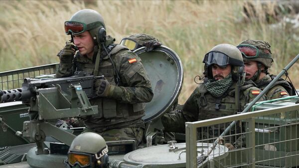Spain's soldiers ride their military vehicle during the NATO military exercises ''Namejs 2021.'' - Sputnik भारत