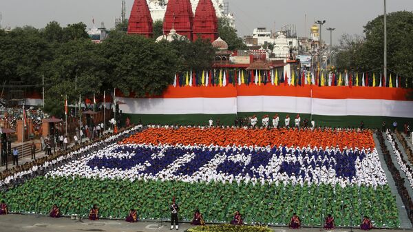 Indian children sit in formation to spell out the Hindi word Bharat - Sputnik India