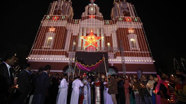 Christian religious heads perform Syro-Malankara Rite, a ritual, at the illuminated Sacred Heart's Cathedral on Christmas Eve in New Delhi, India, Tuesday, Dec. 24, 2013. Though Hindus and Muslims comprise the majority of the population in India, Christmas is celebrated with much fanfare. - Sputnik India
