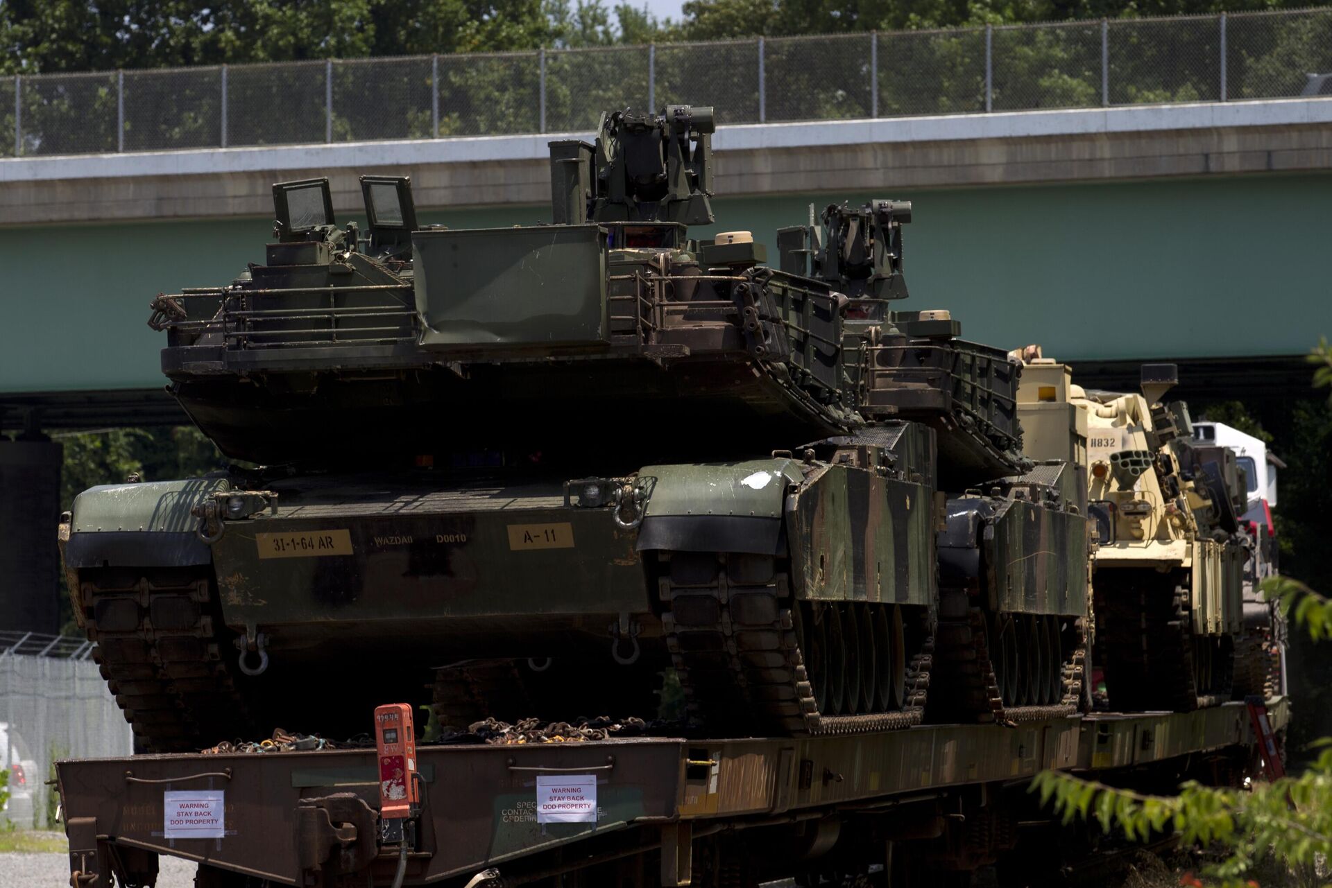 Abrams tanks are seen on a flat car in a rail yard, Tuesday, July 2, 2019, in Washington. - Sputnik भारत, 1920, 23.09.2023