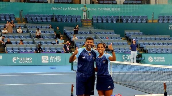 Indian tennis players Rohan Bopanna and Rutuja Bhosale won gold medal in the mixed doubles competition at the 19th Asian Games in Hangzhou, China. - Sputnik India