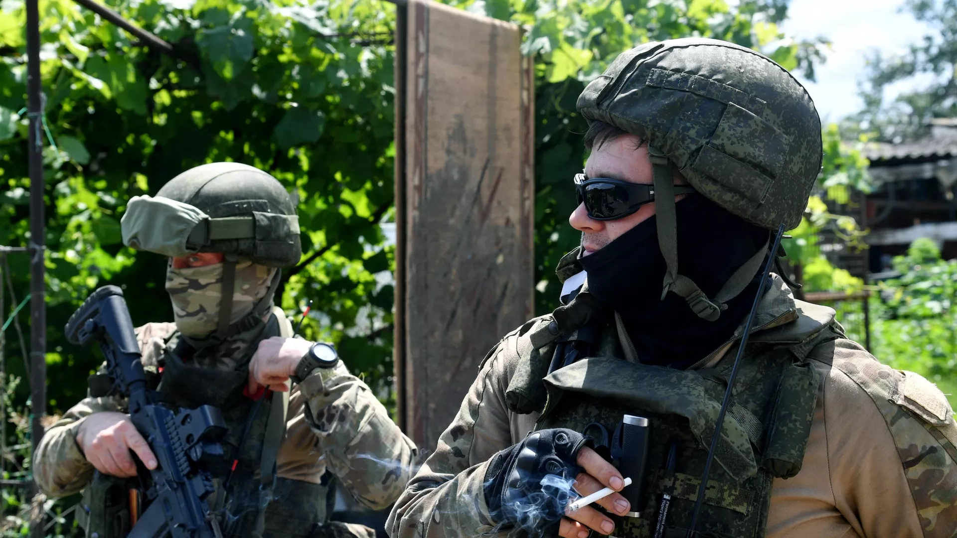 Russian servicemen from the reconnaissance unit of the 1st Guards Tank Army of the Zapad Group of Forces stand at a position in the course of Russia's military operation in Ukraine.
