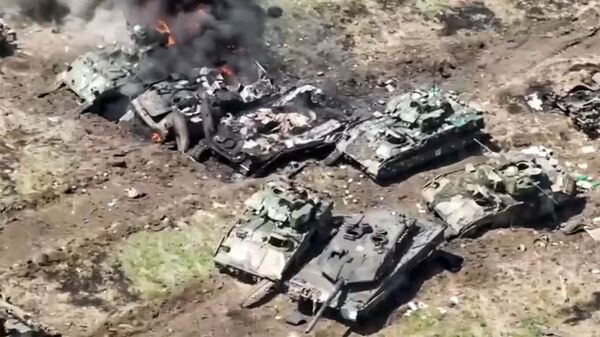 Leopard 2 and Bradley pictured among destroyed and damaged Ukrainian vehicles. Screenshot of Russian Defense Ministry video. - Sputnik भारत
