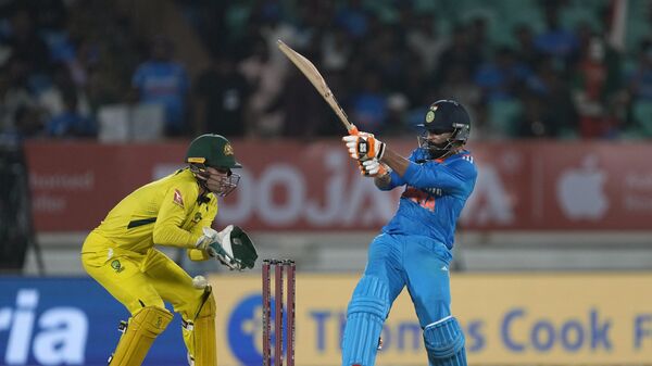 India's Ravindra Jadeja plays a shot during the third one day international cricket match between Australia and India in Rajkot, India, Wednesday, Sept. 27, 2023. - Sputnik India