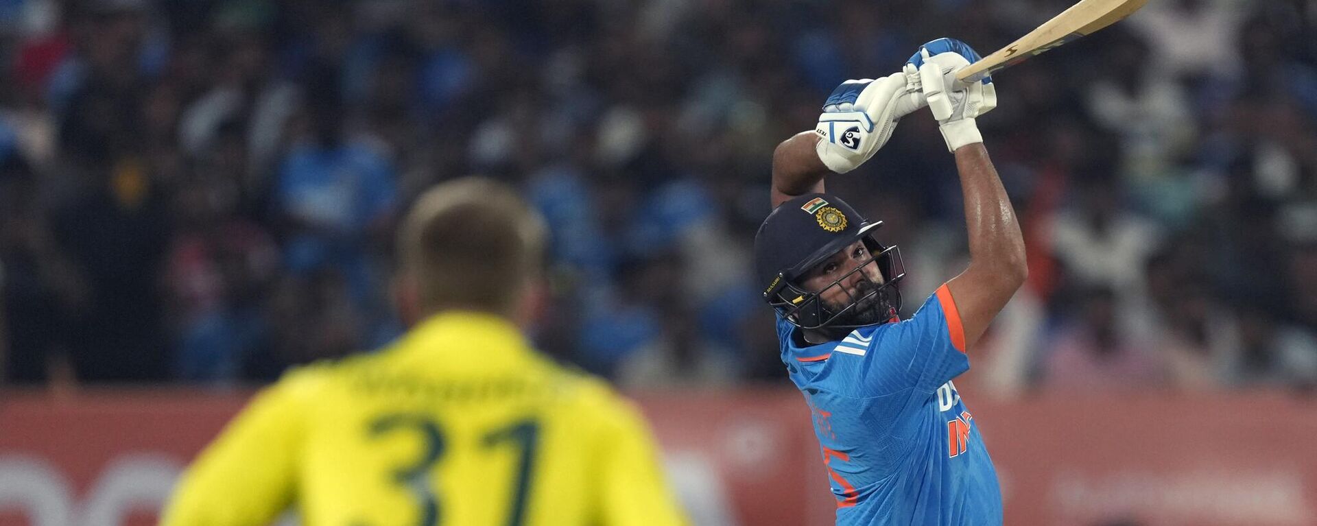 India's captain Rohit Sharma plays a shot during the third one day international cricket match between Australia and India in Rajkot, India, Wednesday, Sept. 27, 2023.  - Sputnik India, 1920, 07.11.2023