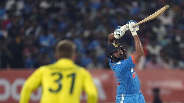India's captain Rohit Sharma plays a shot during the third one day international cricket match between Australia and India in Rajkot, India, Wednesday, Sept. 27, 2023.  - Sputnik India