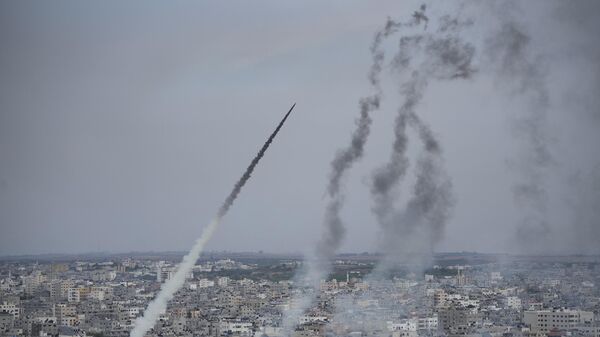 Rockets are launched by Palestinian militants from the Gaza Strip towards Israel, in Gaza, Saturday, Oct. 7, 2023.  - Sputnik भारत