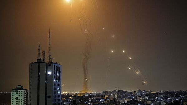 A rocket launched from Gaza city controlled by the Palestinian Hamas movement, is intercepted by Israel's Iron Dome aerial defence system, on May 11, 2021. - Sputnik India