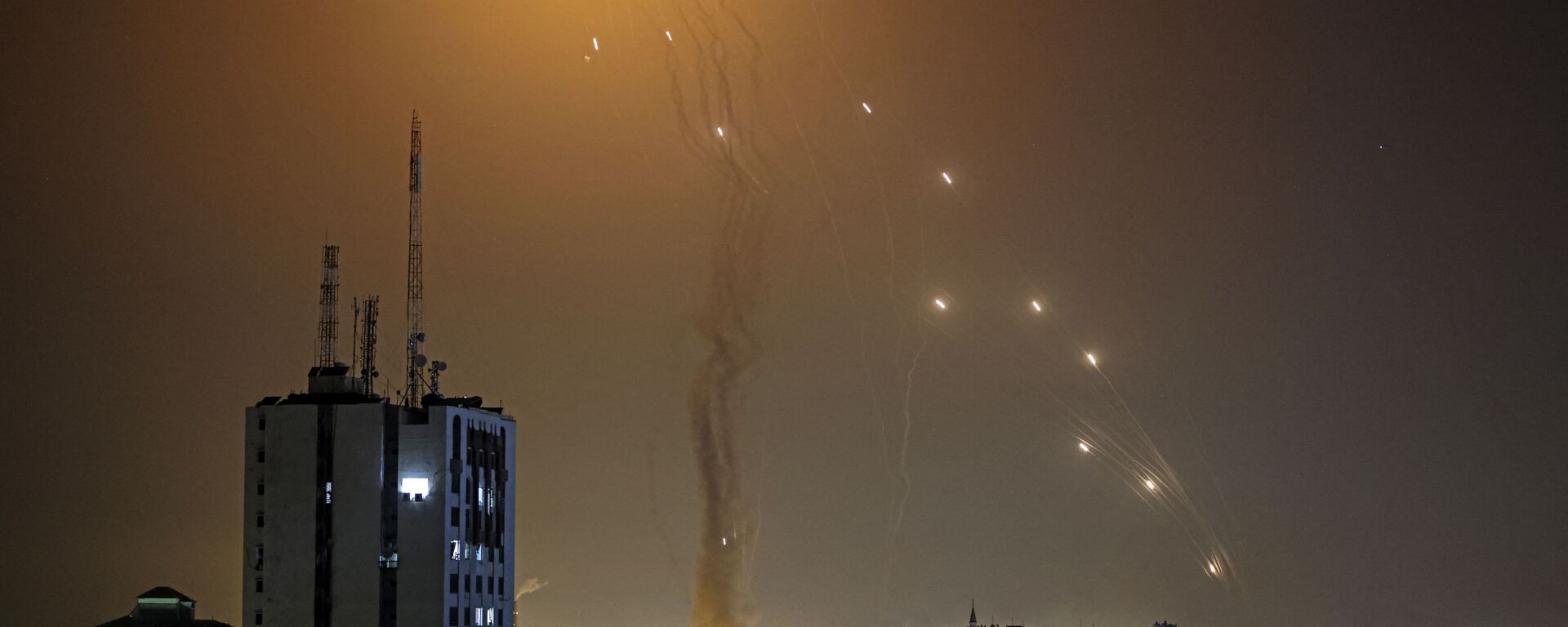 A rocket launched from Gaza city controlled by the Palestinian Hamas movement, is intercepted by Israel's Iron Dome aerial defence system, on May 11, 2021. - Sputnik India, 1920, 08.10.2023