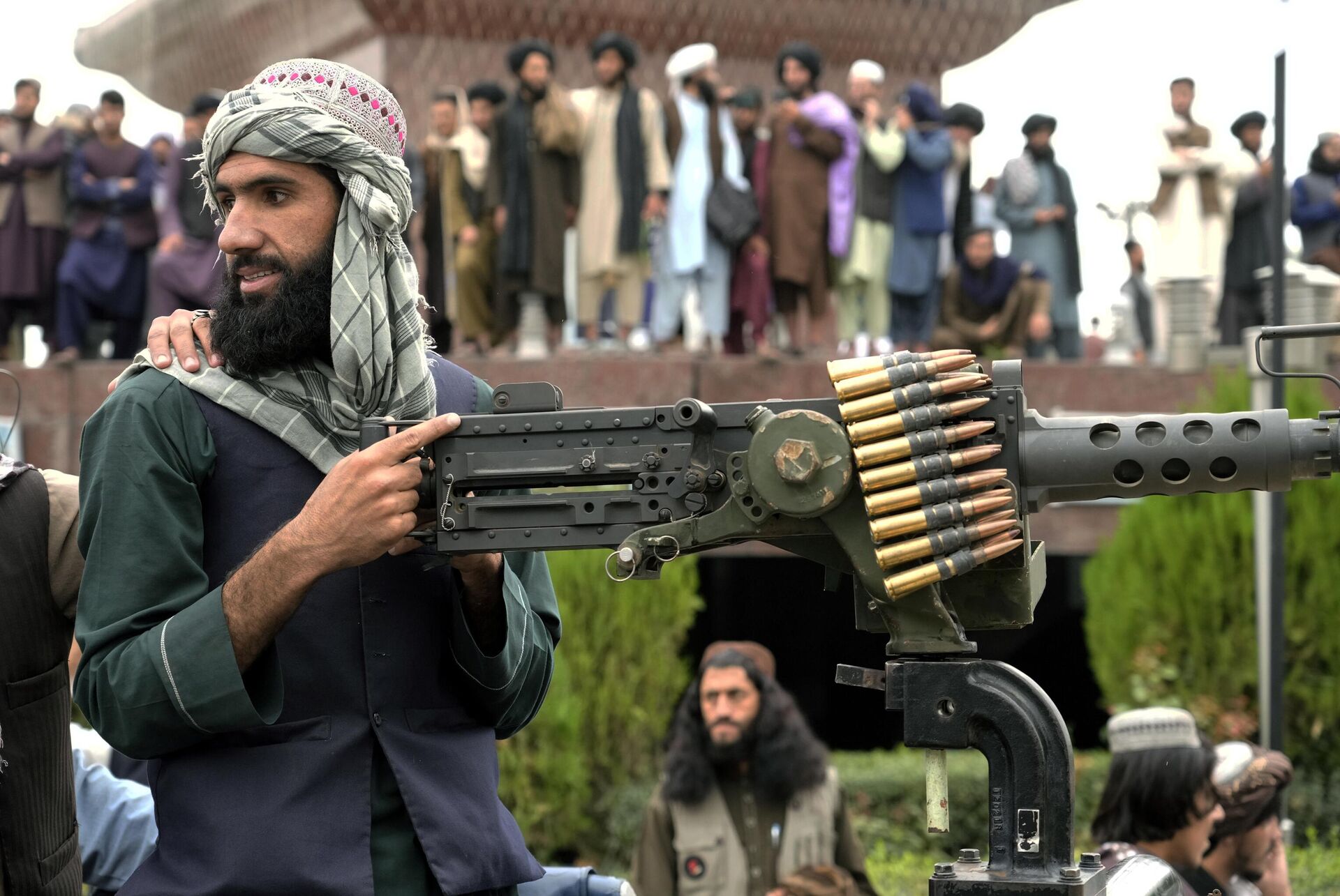 A Taliban fighter mans his weapon during celebrations one year after the Taliban seized the Afghan capital, Kabul, in front of the U.S. Embassy in Kabul, Afghanistan, Monday, Aug. 15, 2022.  - Sputnik India, 1920, 09.10.2023