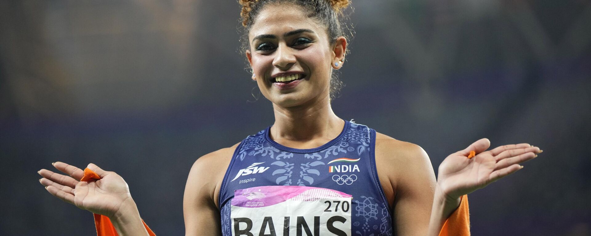 India's Harmilan Bains celebrates her second place finish to win the silver medal in the women's 800-meter final at the 19th Asian Games in Hangzhou, China, Wednesday, Oct. 4, 2023. - Sputnik India, 1920, 09.10.2023