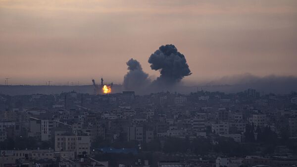Smoke rises after the Israeli air strike in the Gaza Strip - Sputnik India