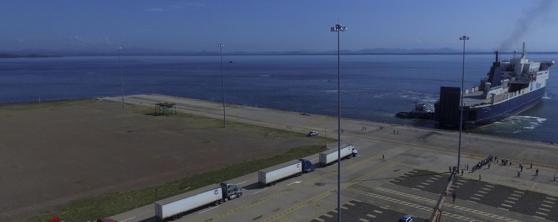Trucks line up to be loaded into the Blue Wave Ferry during the inaugural trip between El Salvador and Costa Rica, at the port in La Union, El Salvador, Thursday, Aug. 10, 2023. - Sputnik भारत, 1920, 14.10.2023