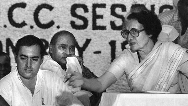 In this picture taken early 1984 shows Indian prime minister Indira Gandhi (R) and her son Rajiv (L) at a Congress Party meeting in New Delhi. India's oldest party, the Congress, virtually written off by political pundits and rivals, made a stunning comeback in national polls 13 May 2004, under the leadership of Sonia Gandhi with results showing the party and its allies sweeping the ruling Hindu nationalist Bharatiya Janata Party (BJP) and its coalition partners from power. - Sputnik India