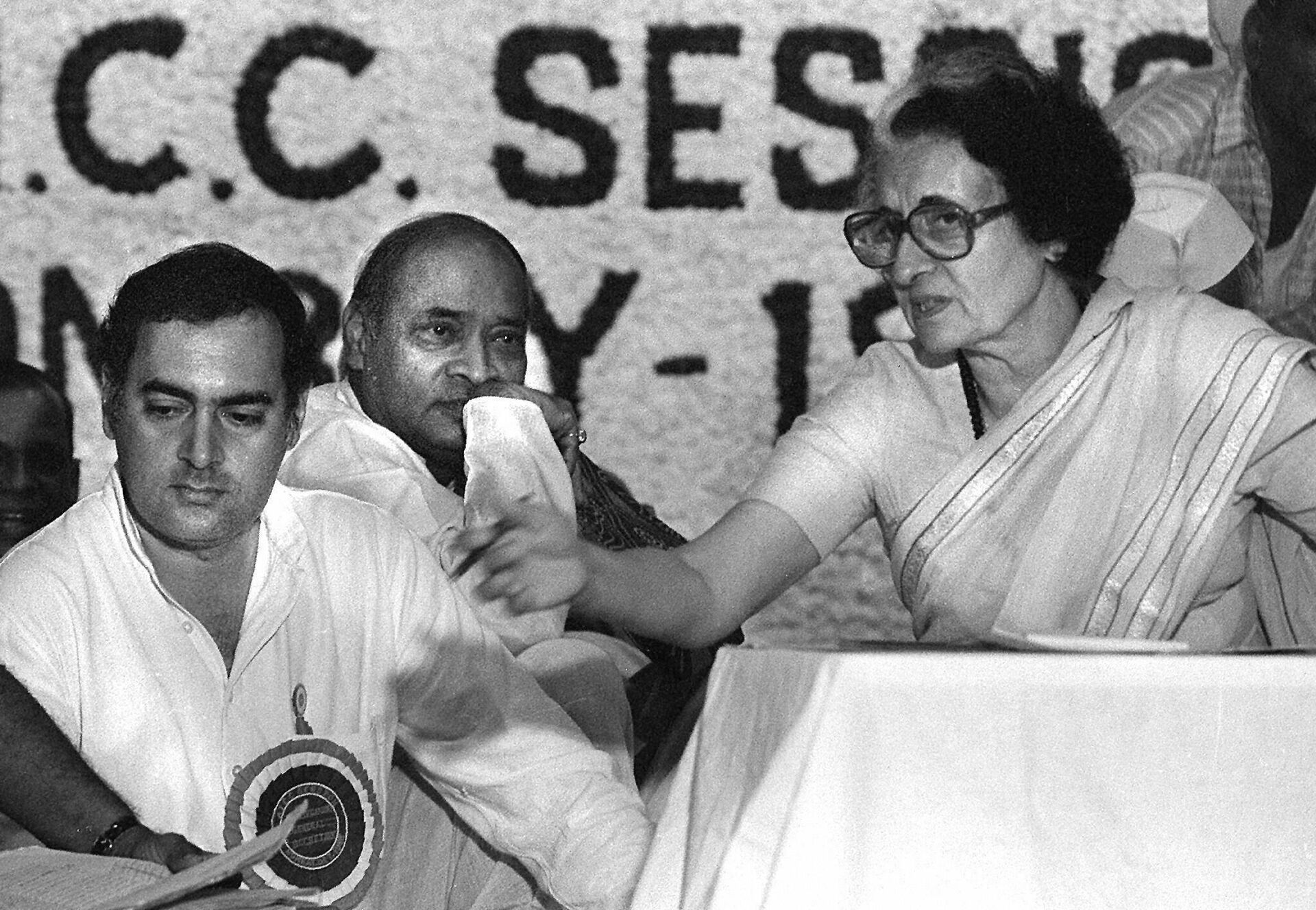 In this picture taken early 1984 shows Indian prime minister Indira Gandhi (R) and her son Rajiv (L) at a Congress Party meeting in New Delhi. India's oldest party, the Congress, virtually written off by political pundits and rivals, made a stunning comeback in national polls 13 May 2004, under the leadership of Sonia Gandhi with results showing the party and its allies sweeping the ruling Hindu nationalist Bharatiya Janata Party (BJP) and its coalition partners from power. - Sputnik India, 1920, 14.10.2023