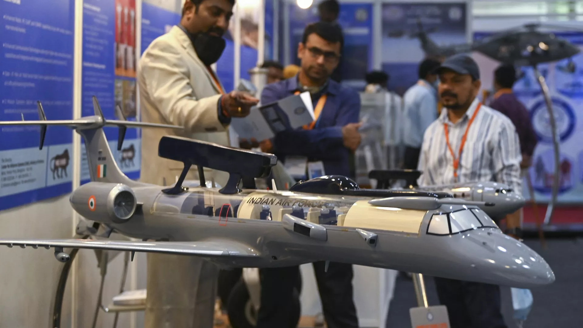 Visitors look at a model of the Defence Research and Development Organisations (DRDO) Airborne early warning control system displayed at the Defence and Technology Expo Empowering MSME in Chennai on May 26, 2022