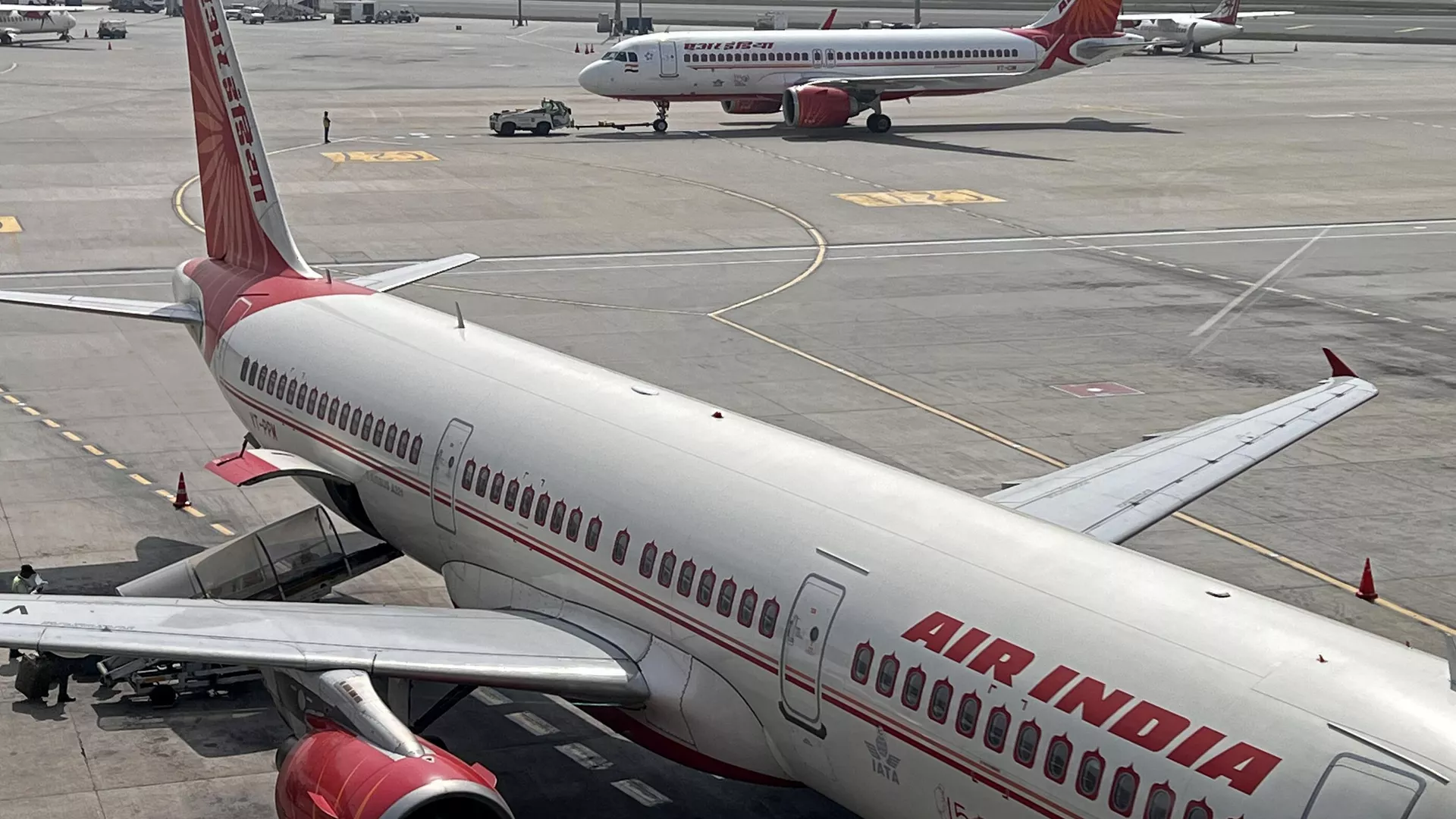 Air India aircrafts stand on the tarmac at the Indira Gandhi International Airport in New Delhi on February 28, 2023.