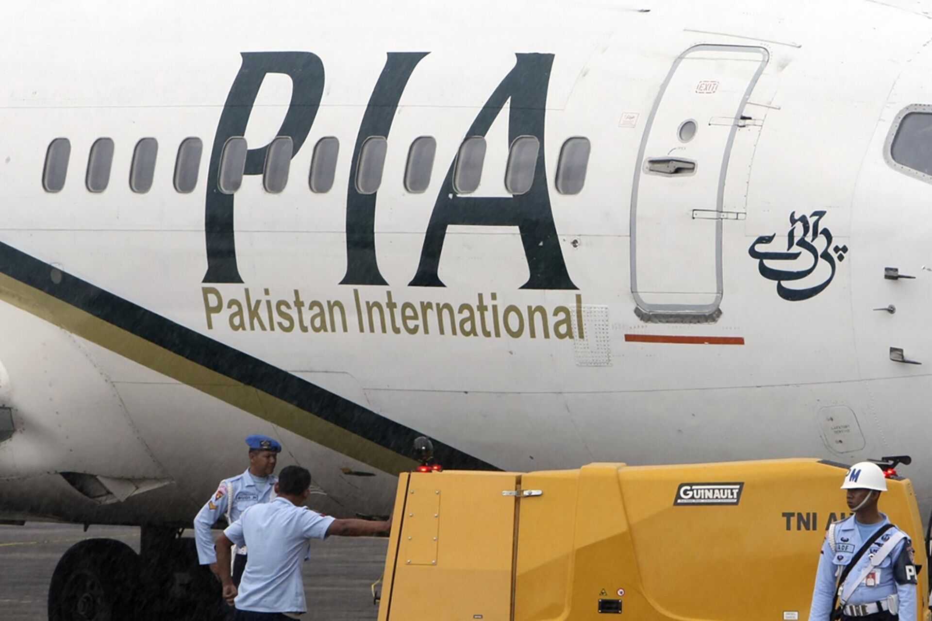 In this March 7, 2011, file photo, a Pakistan International Airlines passenger jet is parked on the tarmac at a military base in Makassar, Indonesia. - Sputnik India, 1920, 21.10.2023