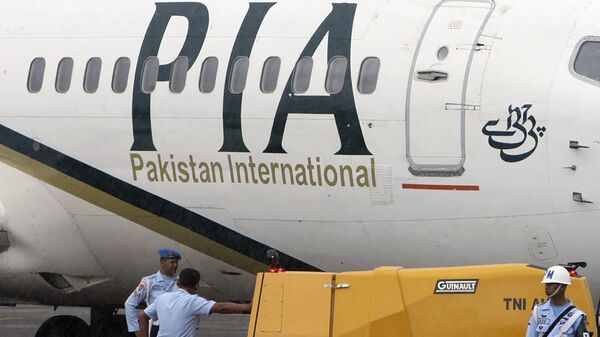 In this March 7, 2011, file photo, a Pakistan International Airlines passenger jet is parked on the tarmac at a military base in Makassar, Indonesia. - Sputnik India