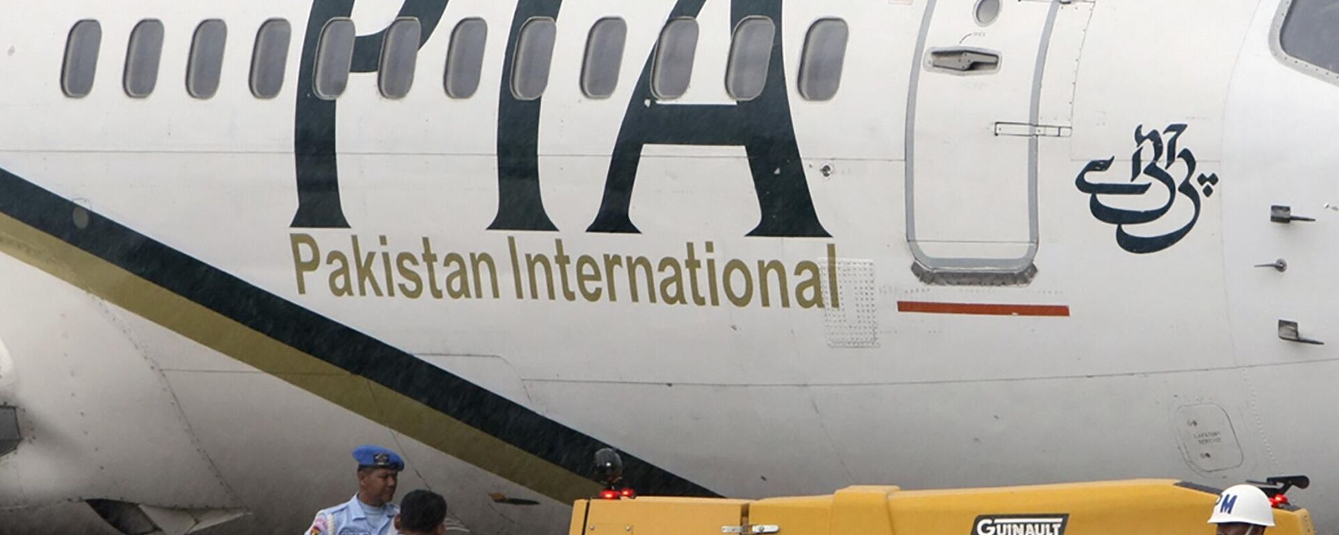In this March 7, 2011, file photo, a Pakistan International Airlines passenger jet is parked on the tarmac at a military base in Makassar, Indonesia. - Sputnik India, 1920, 17.10.2023