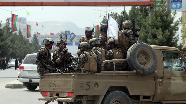 FILE - Taliban special force fighters arrive inside the Hamid Karzai International Airport after the U.S. military's withdrawal, in Kabul, Afghanistan, Aug. 31, 2021. A year after America's tumultuous and deadly withdrawal from Afghanistan, assessments of its impact are divided — and largely along partisan lines. - Sputnik India