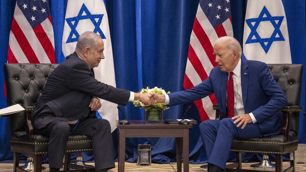 US President Joe Biden shakes hands with Israeli Prime Minister Benjamin Netanyahu as they meet on the sidelines of the 78th United Nations General Assembly in New York City on September 20, 2023.  - Sputnik India