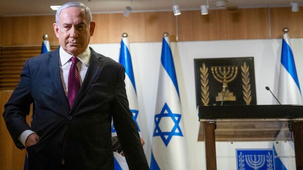 In this file photo taken on December 22, 2020 Israeli Prime Minister Benjamin Netanyahu leaves after a speech at the Knesset (Israeli Parliament) in Jerusalem - Sputnik India