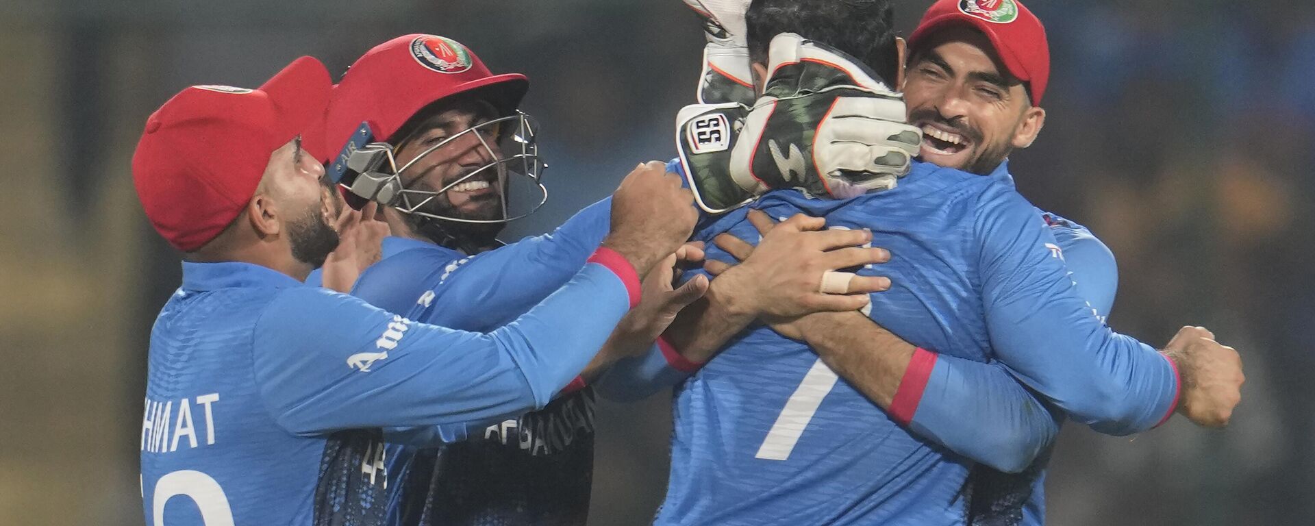 Afghanistan's team members celebrate the wicket of England's Sam Curran with bowler Mohammad Nabi during the ICC Men's Cricket World Cup match between Afghanistan and England in New Delhi, India, Sunday, Oct. 15, 2023.  - Sputnik भारत, 1920, 19.10.2023